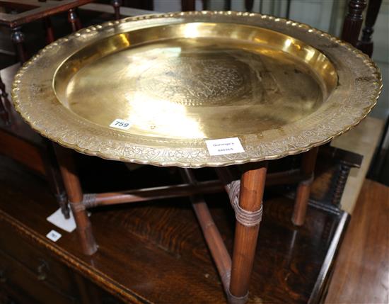 Engraved brass Benares tray, on folding stand